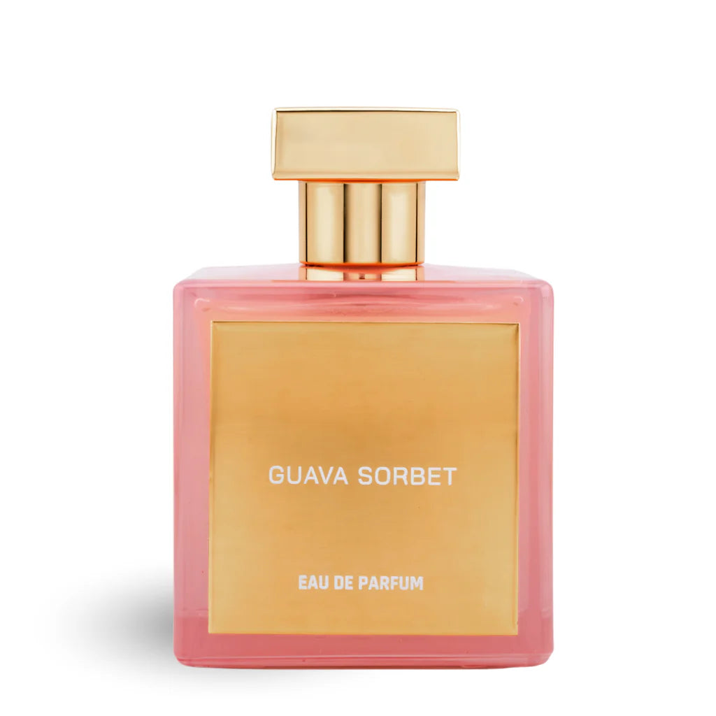 House of Brandt Guava Sorbet eau de parfum in a translucent pink square bottle with a warm gold front plaque, gold neck and wide rectangular gold cap on a white background.